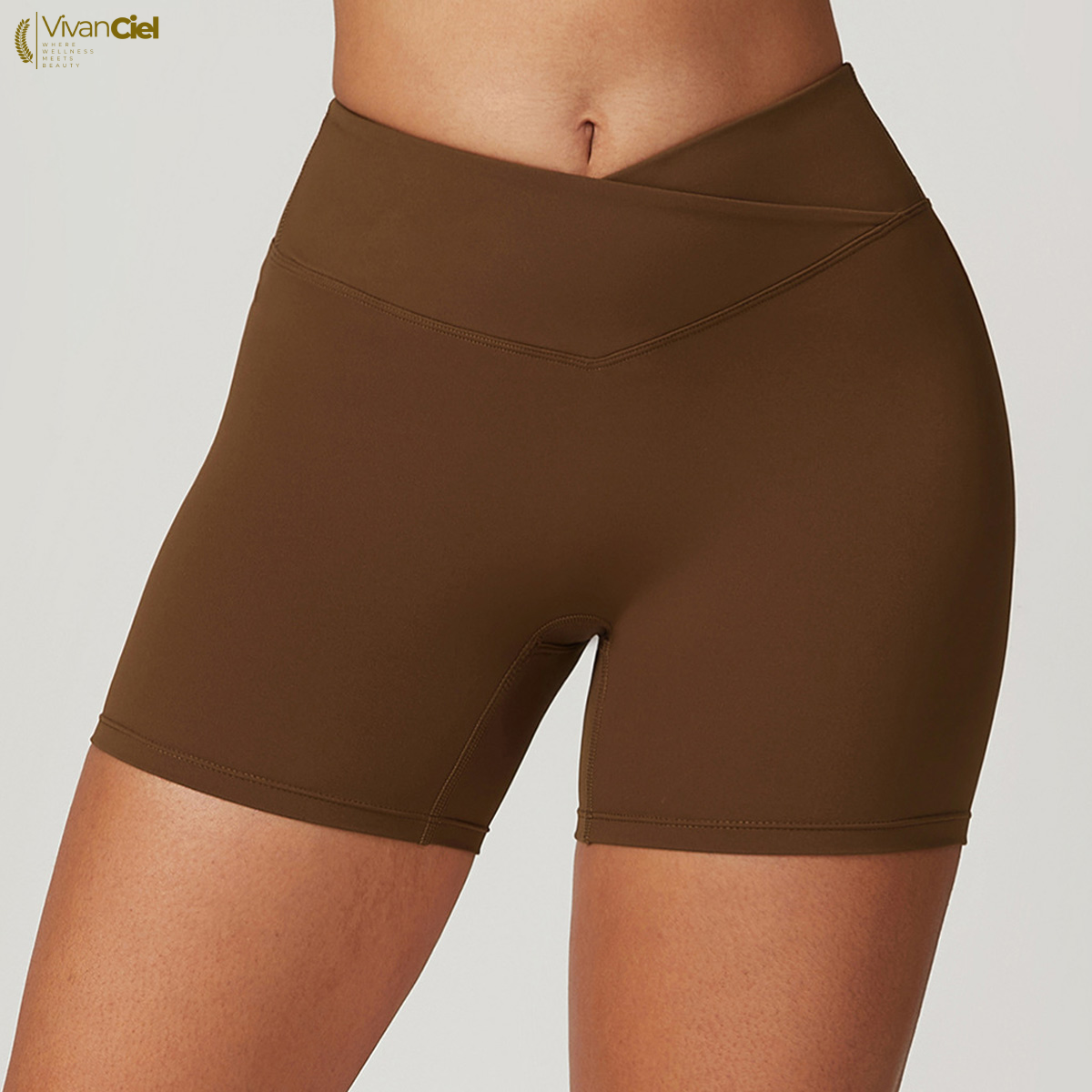 Brown athletic shorts worn by a person on a plain background