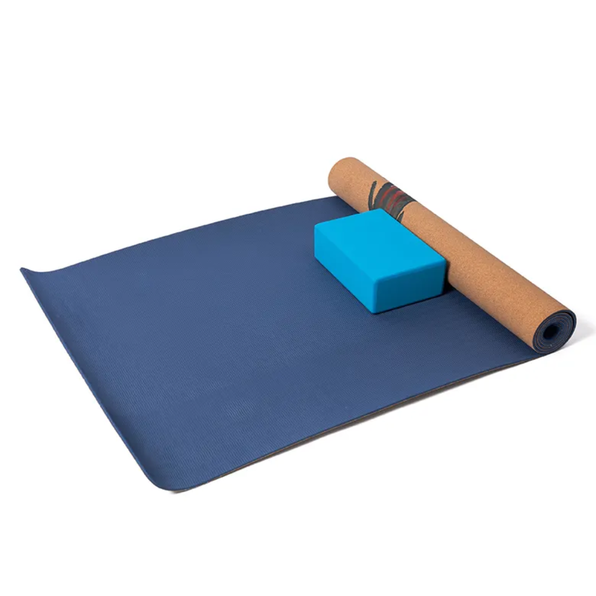 Blue yoga mat with a foam block and rolled-up cork mat on a white background